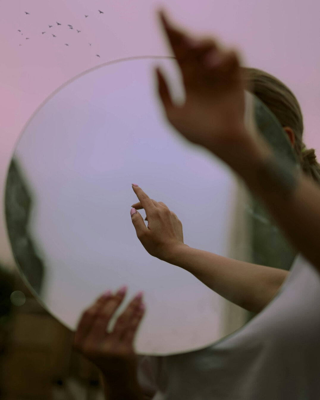 person reflecting in mirror