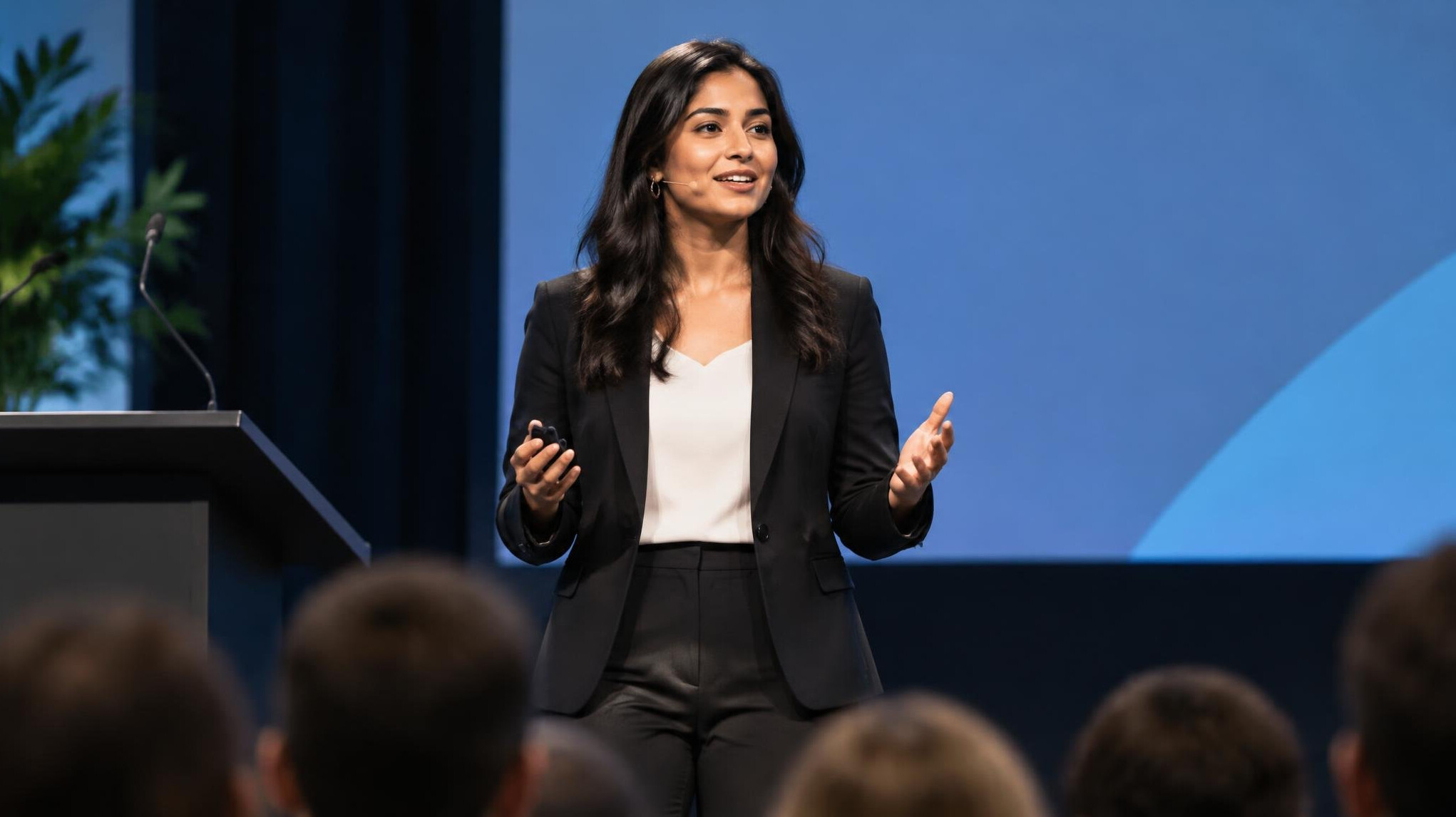 woman speaking confidently on stage
